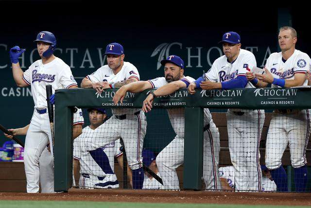 The Texas Rangers react after the Cincinnati Reds hit a home run to take the lead during the ninth inning on Friday, April 3, 2026.